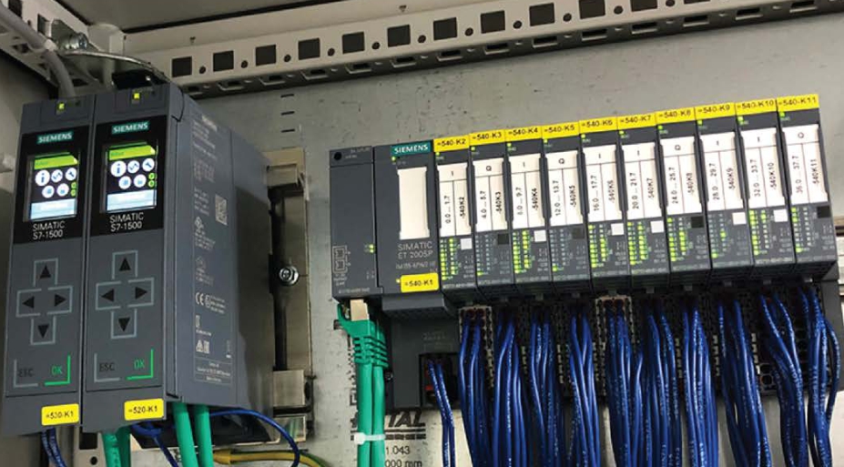 Siemens SIMATIC controller and I/O modules in a wired cabinet